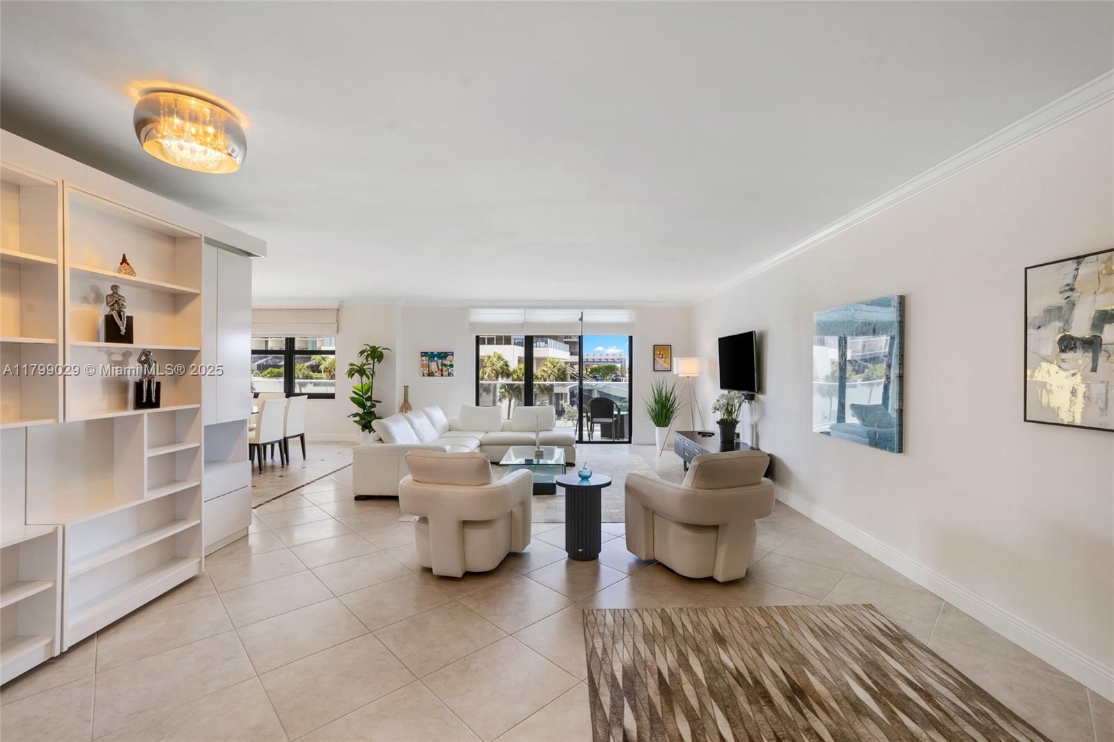 9801 Collins Avenue, Unit 5S Bal Harbour, FL 33154 - Photo 2 of 32 a living room with furniture and a window
