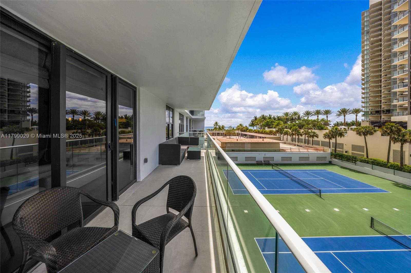 9801 Collins Avenue, Unit 5S Bal Harbour, FL 33154 - Photo 29 of 32 a view of a balcony with chairs