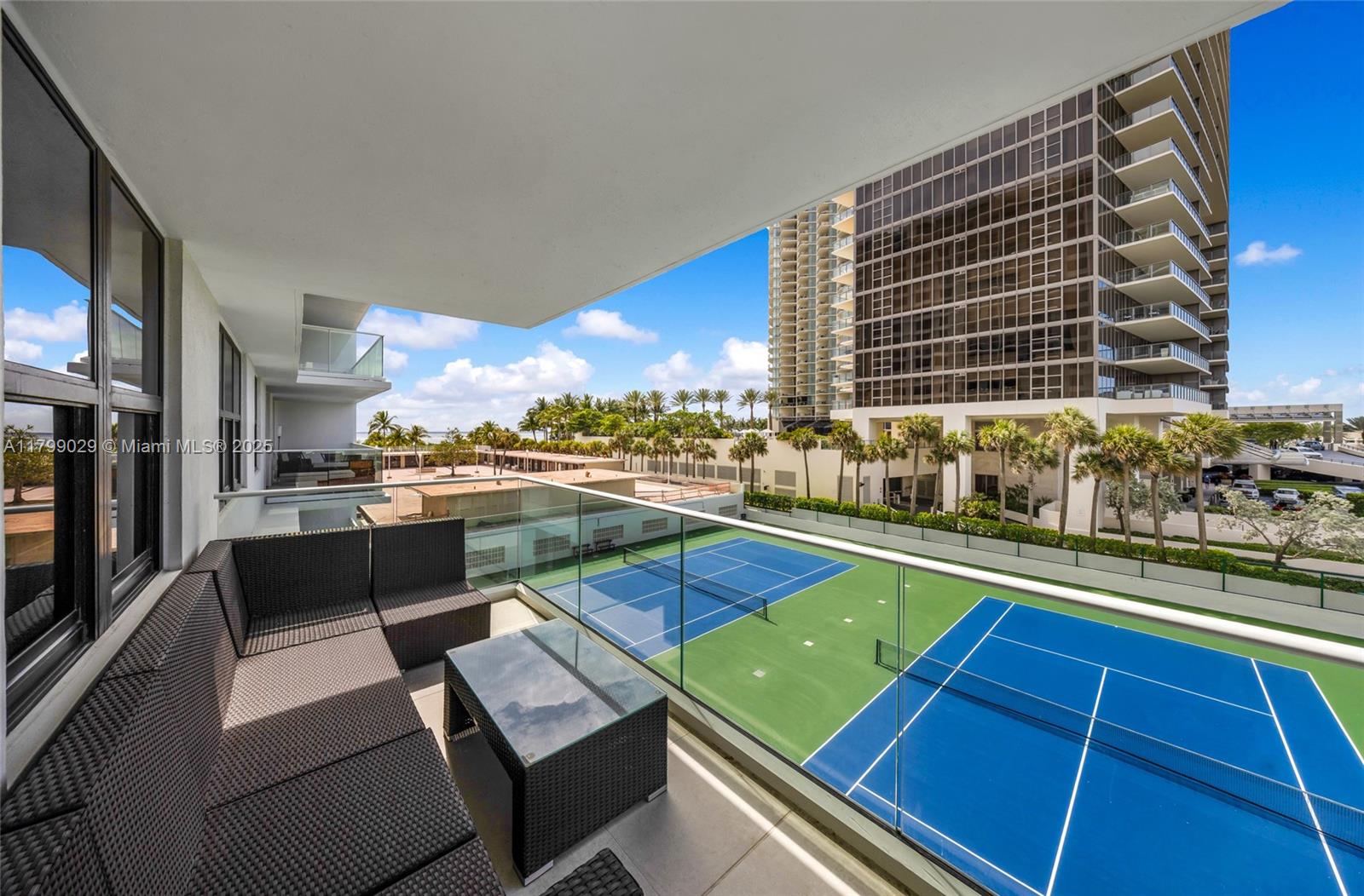 9801 Collins Avenue, Unit 5S Bal Harbour, FL 33154 - Photo 30 of 32 a view of a pool with outdoor seating