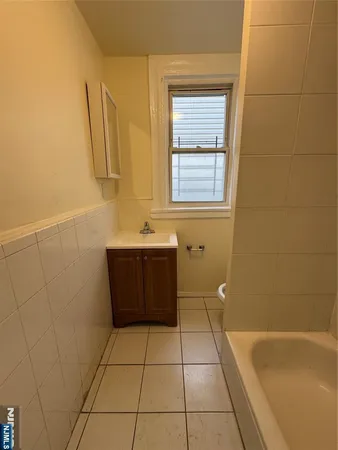 a bathroom with a bathtub sink and toilet