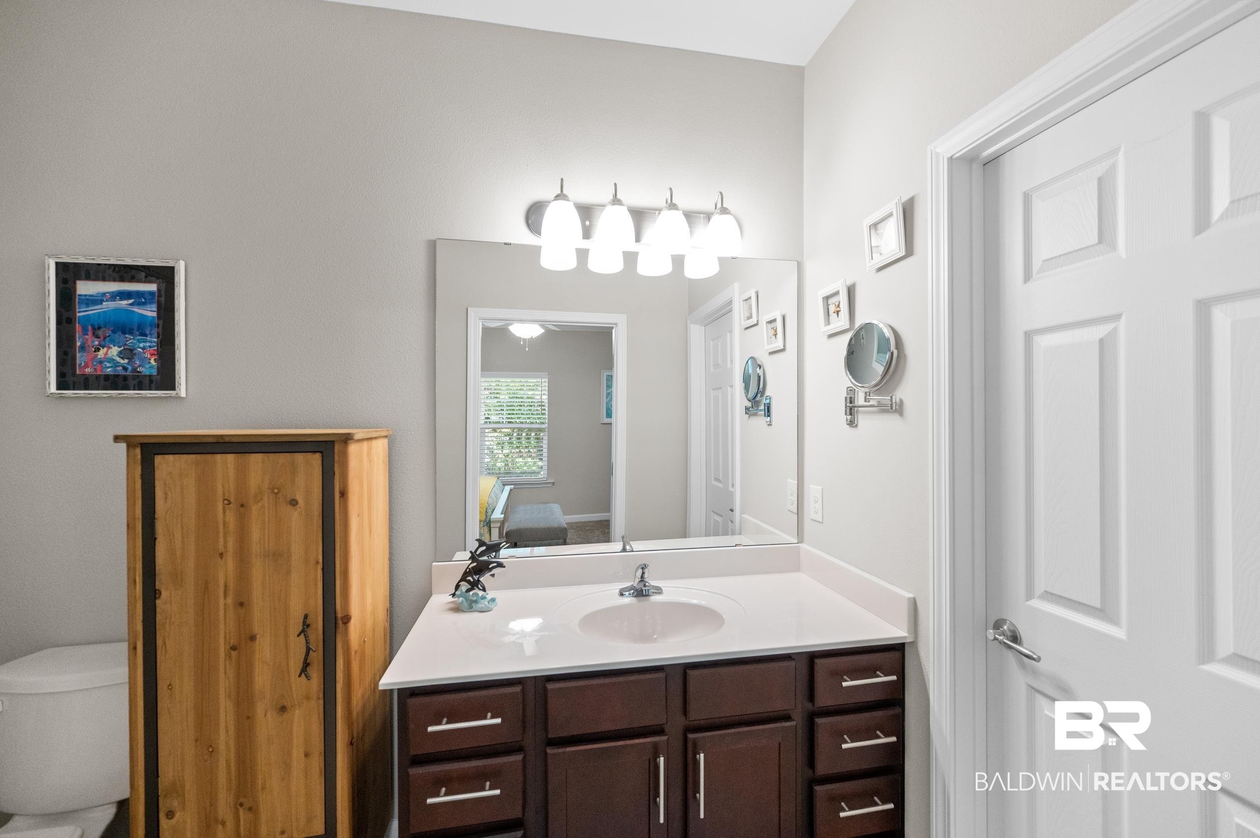 430 West Fort Morgan Road, Unit 1902 Gulf Shores, AL 36542 - Photo 22 of 59 Bathroom with vanity and toilet