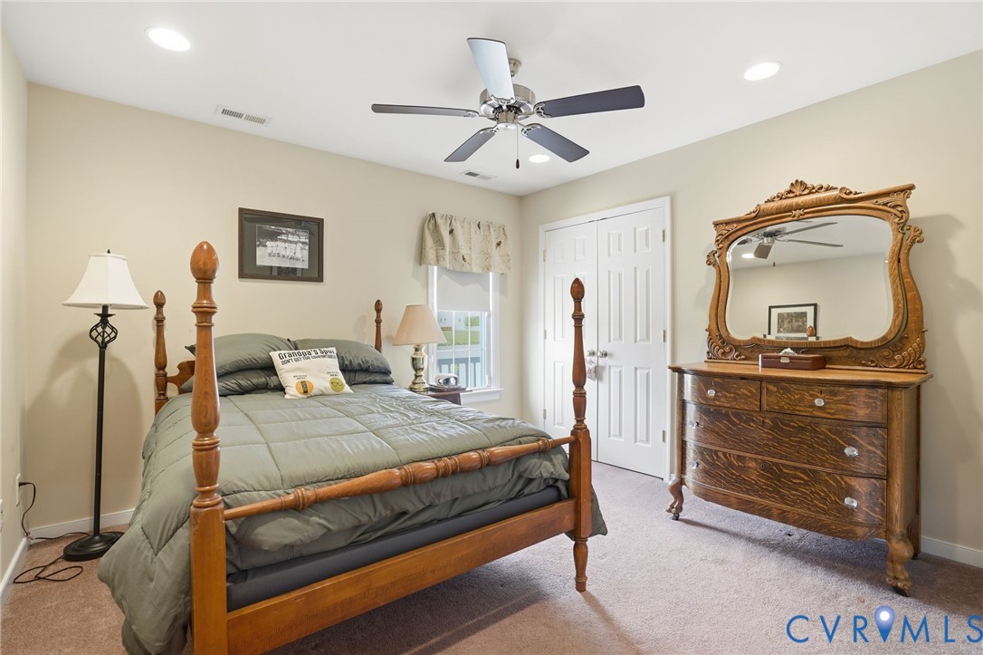 19012 Teman Road Beaverdam, VA 23015 - Photo 22 of 41 a bedroom with a bed and a dresser