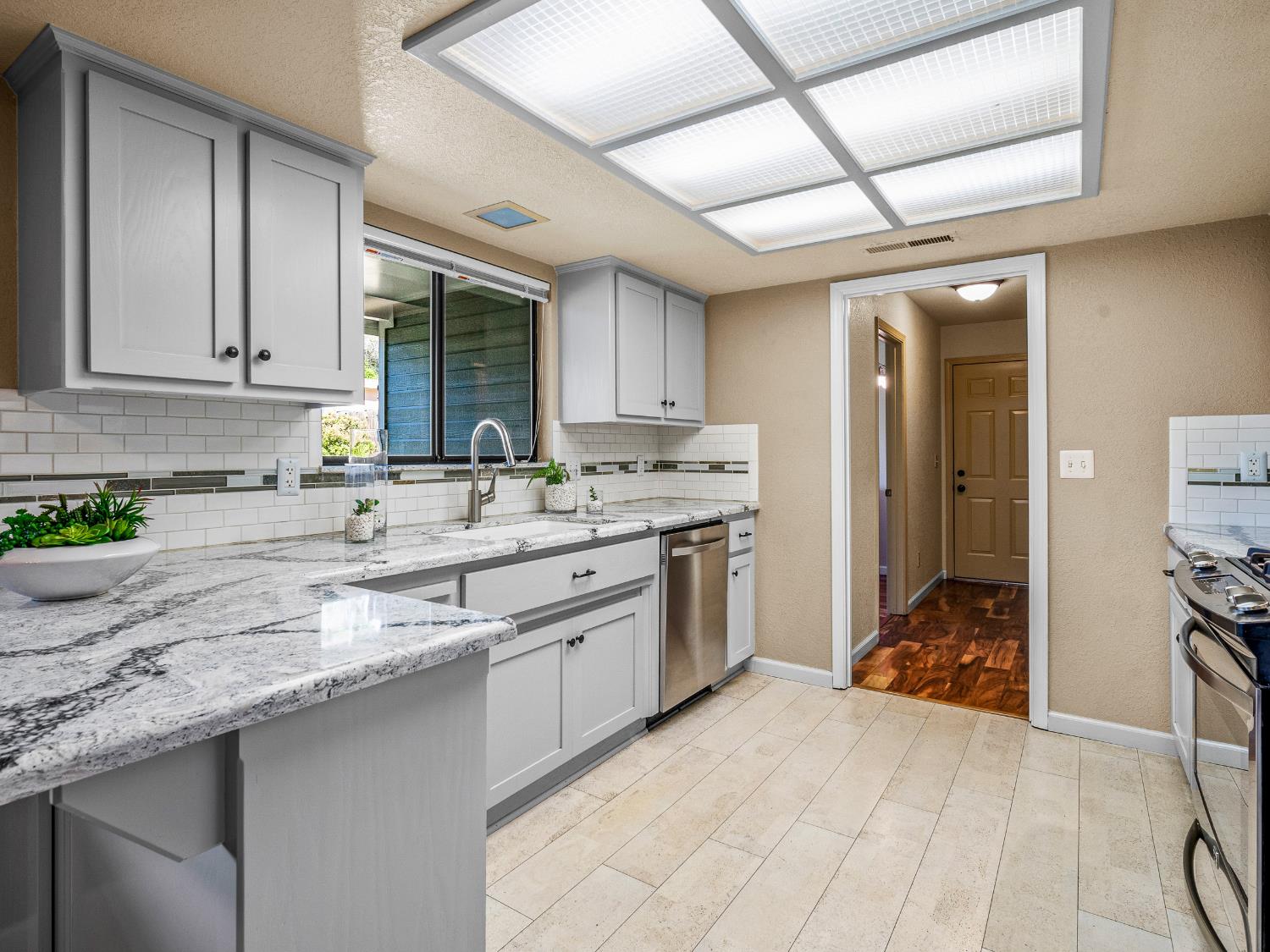 2401 Roxana Street Placerville, CA 95667 - Photo 13 of 45 a kitchen with stainless steel appliances granite countertop a sink stove and cabinets