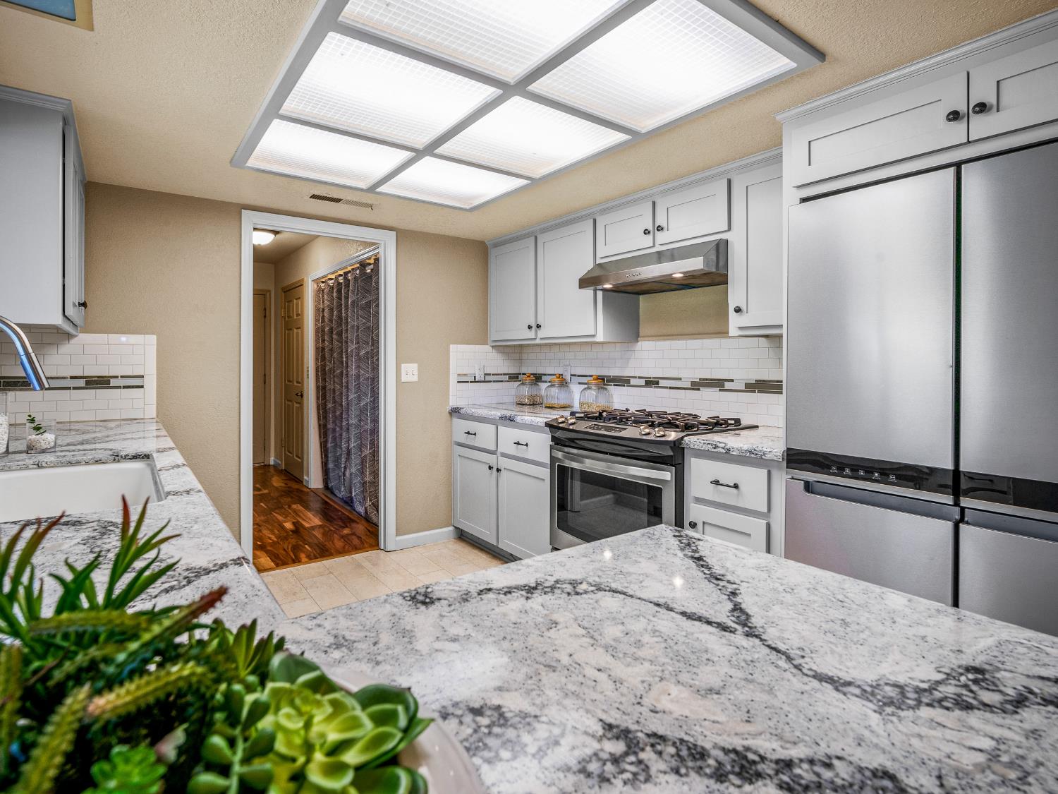 2401 Roxana Street Placerville, CA 95667 - Photo 15 of 45 a kitchen with a refrigerator sink and stainless steel appliances