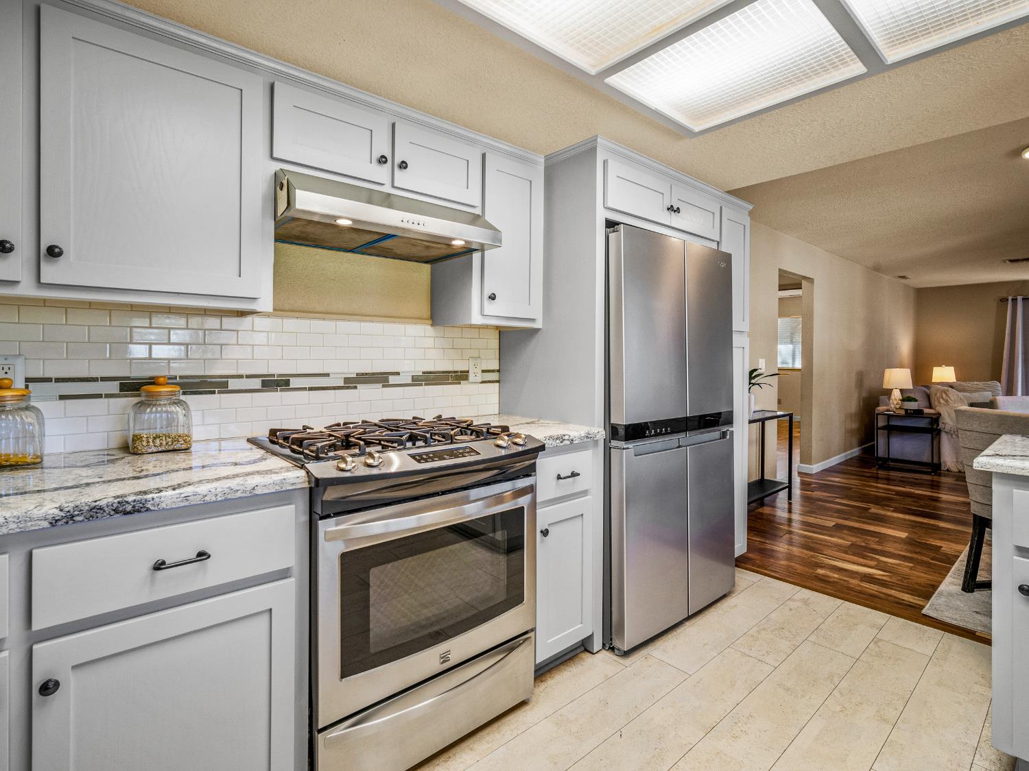 2401 Roxana Street Placerville, CA 95667 - Photo 16 of 45 a kitchen with stainless steel appliances granite countertop a stove a refrigerator and a refrigerator