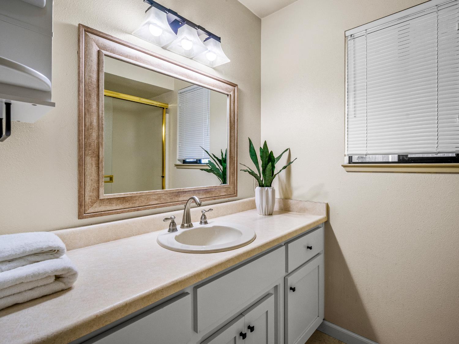 2401 Roxana Street Placerville, CA 95667 - Photo 21 of 45 a bathroom with a sink and a mirror