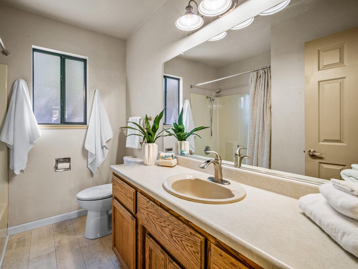 2401 Roxana Street Placerville, CA 95667 - Photo 24 of 45 a bathroom with a sink double vanity and a toilet