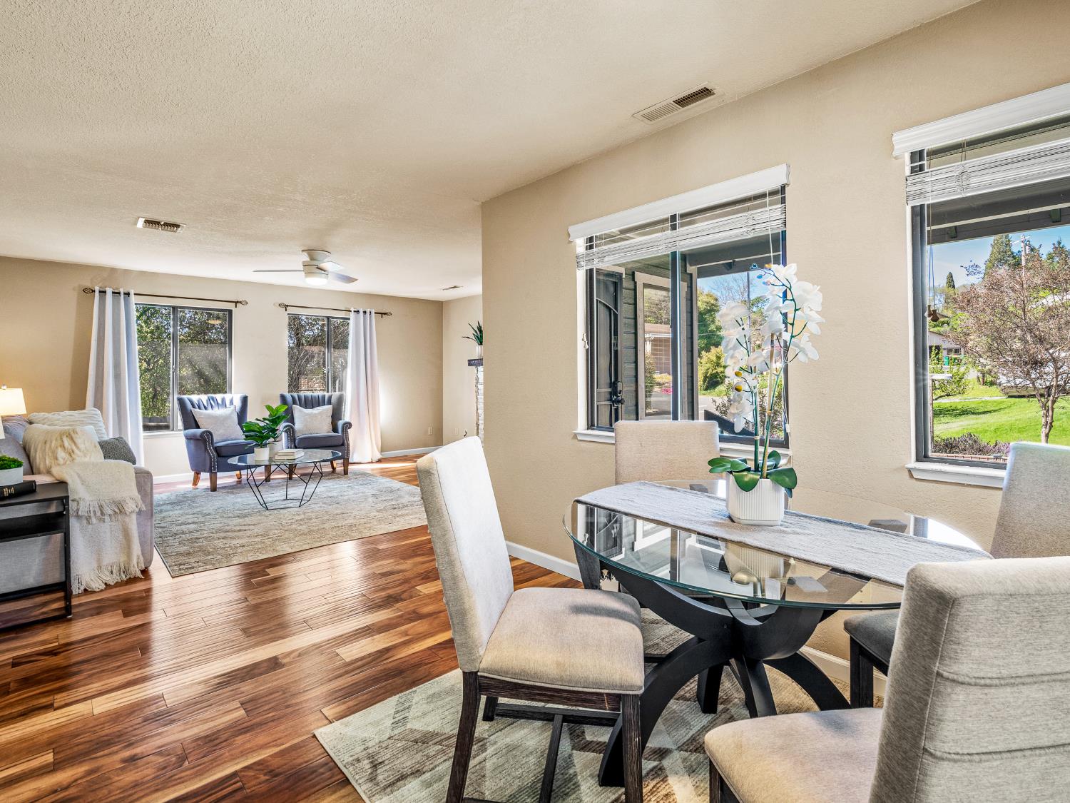 2401 Roxana Street Placerville, CA 95667 - Photo 10 of 45 a view of a dining room with furniture a livingroom and wooden floor
