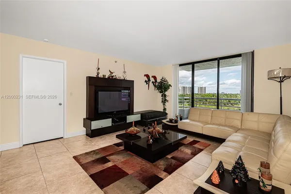 a living room with furniture and a window