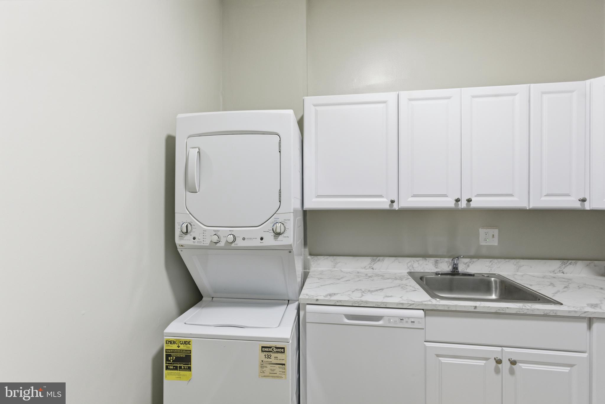 18806 Walkers Choice Road, Unit 2 Montgomery Village, MD 20886 - Photo 13 of 18 a utility room with dryer and washer