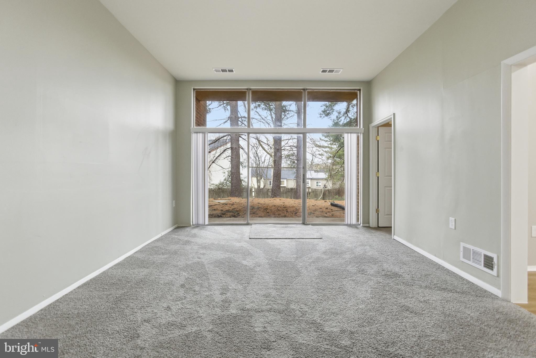 18806 Walkers Choice Road, Unit 2 Montgomery Village, MD 20886 - Photo 2 of 18 a view of an empty room with a window