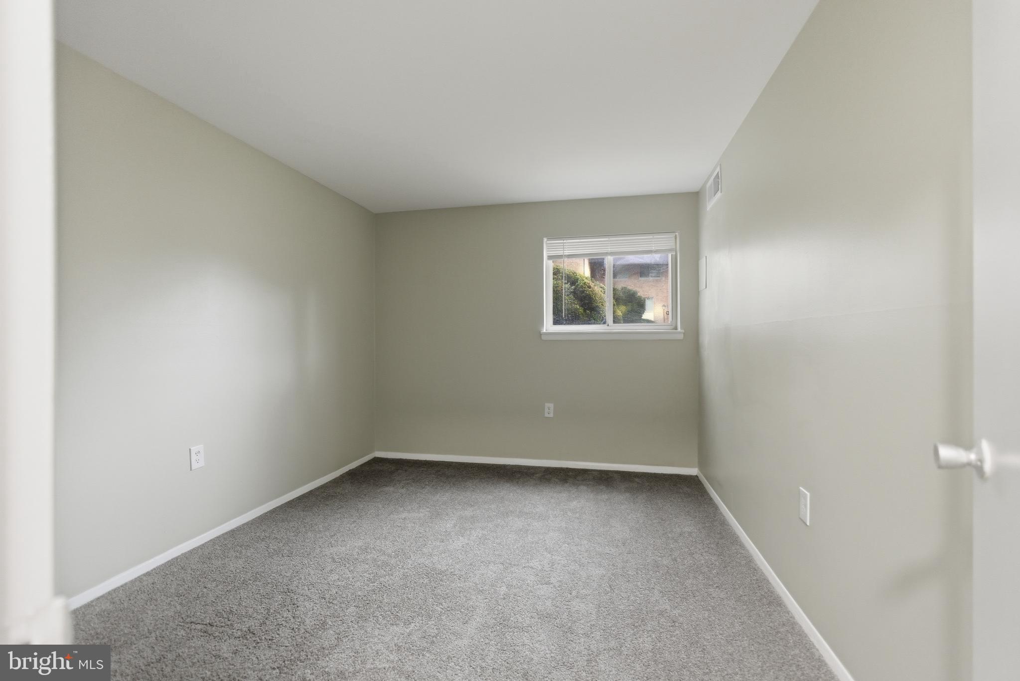 18806 Walkers Choice Road, Unit 2 Montgomery Village, MD 20886 - Photo 5 of 18 an empty room with a window