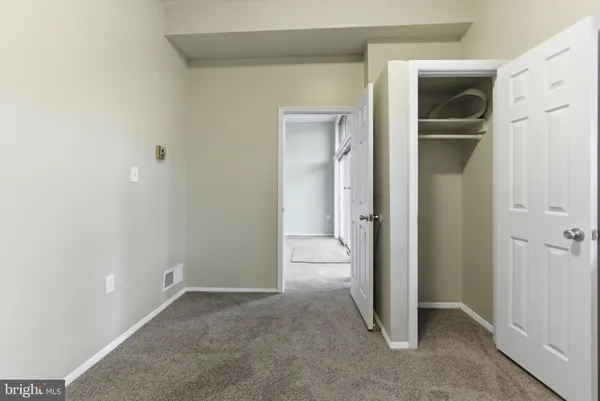 a kitchen with white cabinets sink and white appliances