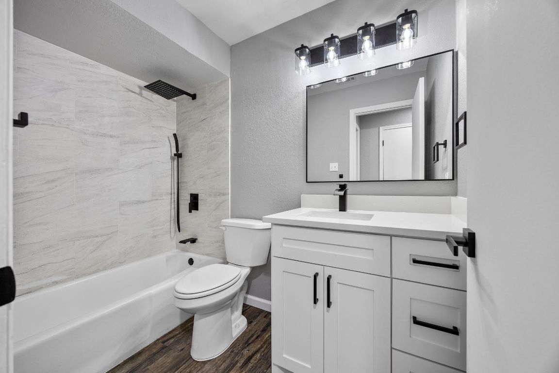 4711 Spicewood Springs Road, Unit 106 Austin, TX 78759 - Photo 15 of 23 a bathroom with a sink toilet and shower