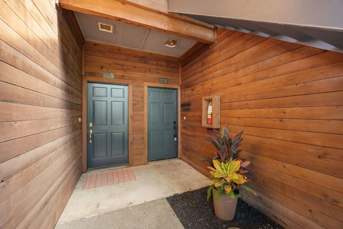 4711 Spicewood Springs Road, Unit 106 Austin, TX 78759 - Photo 18 of 23 a potted plant sitting in front of a door