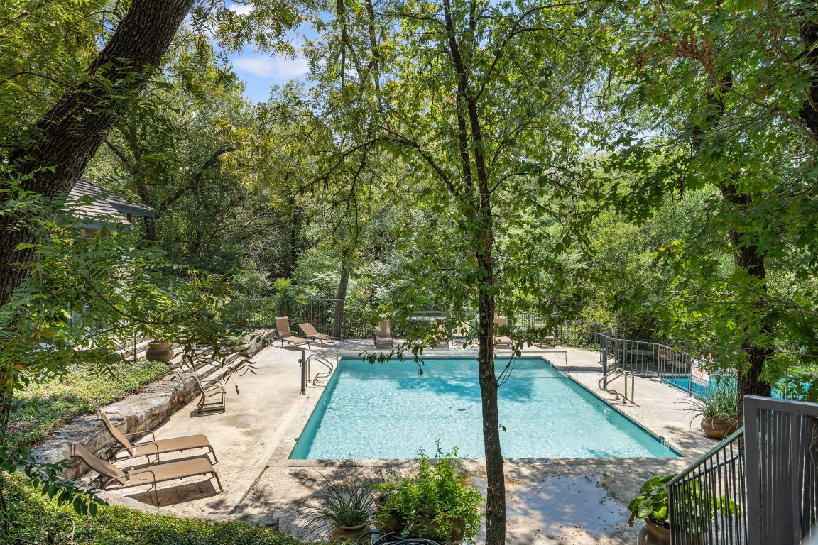 4711 Spicewood Springs Road, Unit 106 Austin, TX 78759 - Photo 22 of 23 a view of a swimming pool with a patio