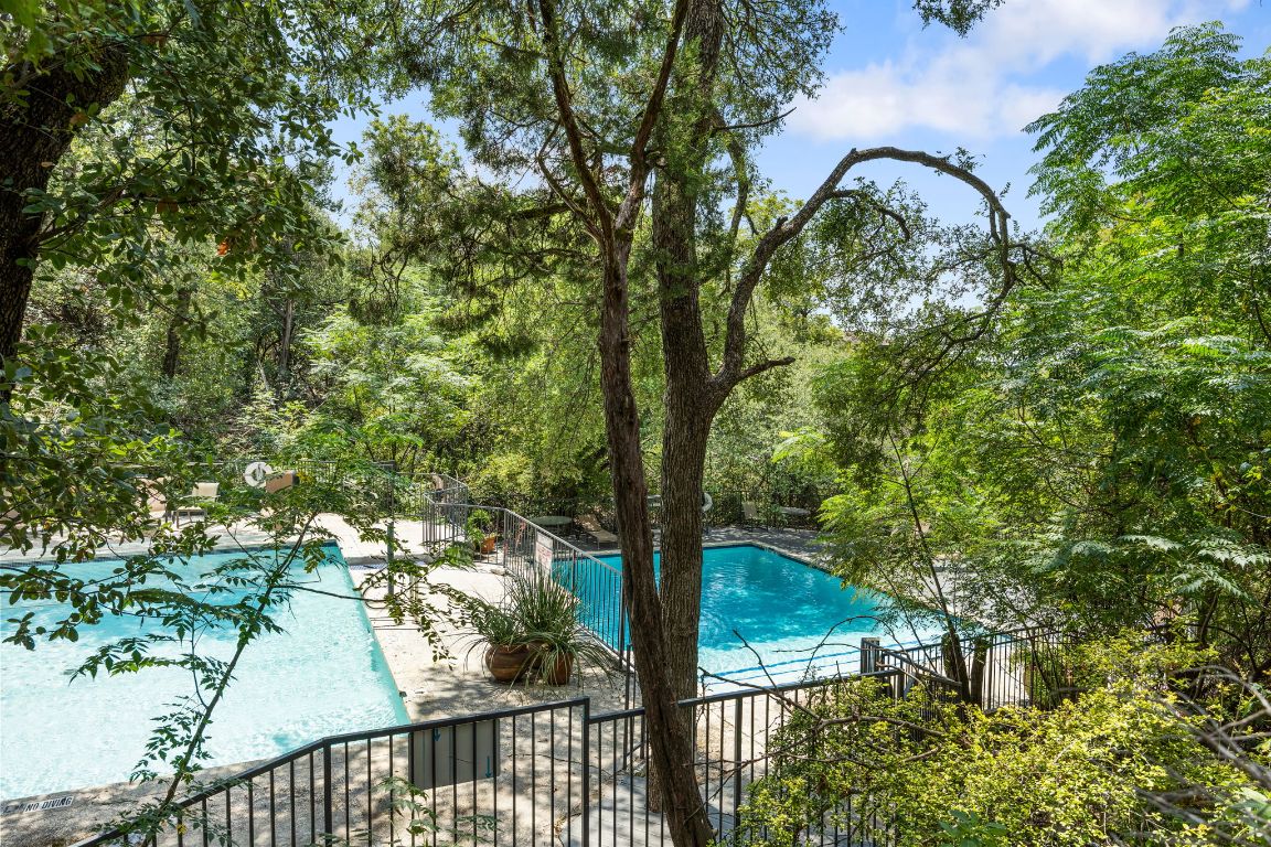 4711 Spicewood Springs Road, Unit 106 Austin, TX 78759 - Photo 23 of 23 a view of a yard and large trees