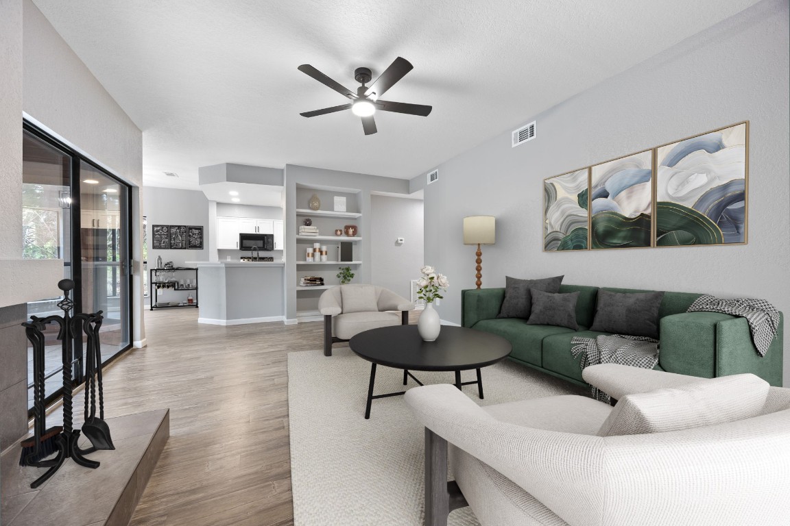 4711 Spicewood Springs Road, Unit 106 Austin, TX 78759 - Photo 4 of 23 a living room with furniture and a view of kitchen