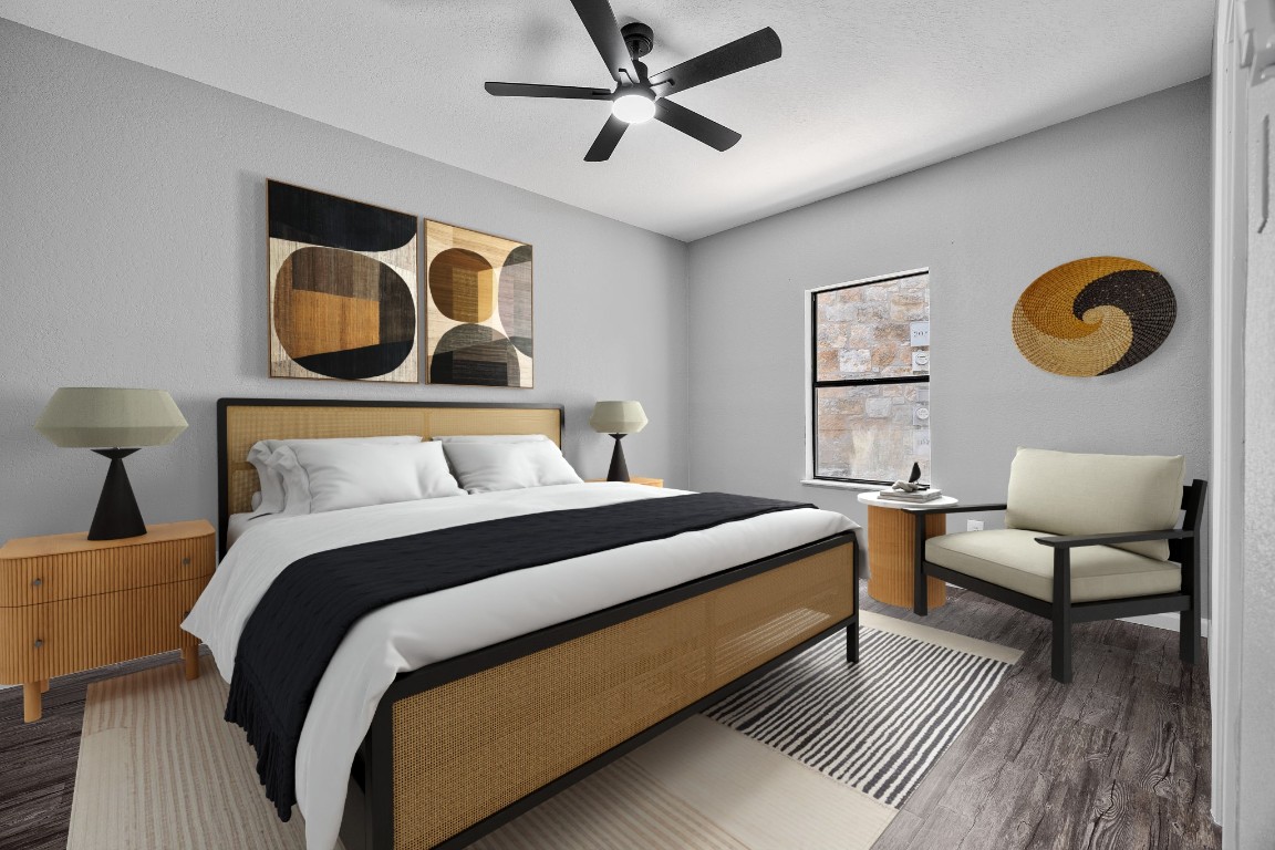 4711 Spicewood Springs Road, Unit 106 Austin, TX 78759 - Photo 10 of 23 a bedroom with a bed and painting on the wall