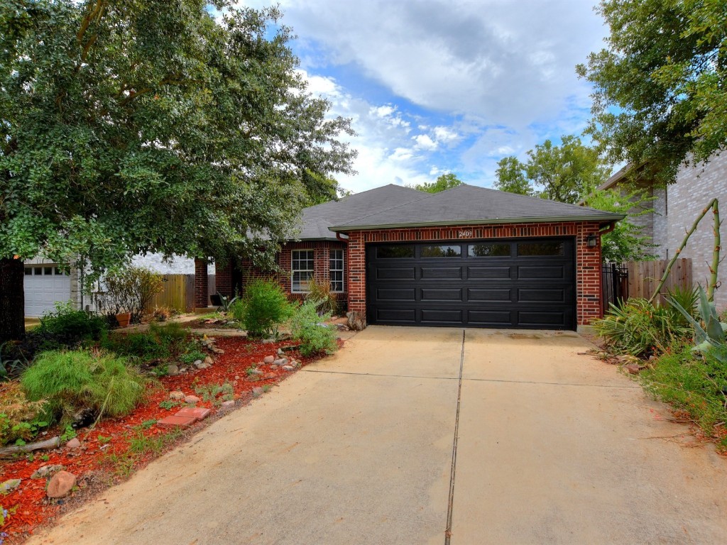 a front view of a house with garage