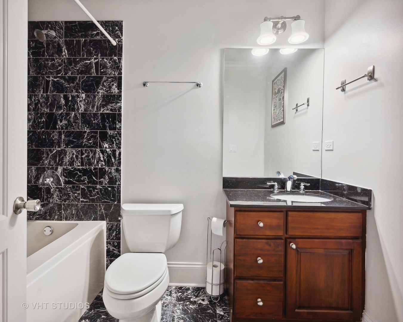 4880 North Clark Street, Unit 2B Chicago, IL 60640 - Photo 11 of 15 a bathroom with a granite countertop sink a toilet and shower