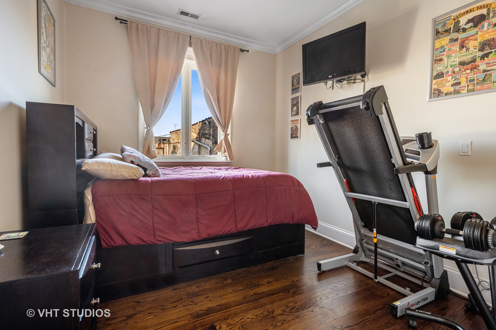4880 North Clark Street, Unit 2B Chicago, IL 60640 - Photo 13 of 15 a bedroom with a bed and a flat screen tv
