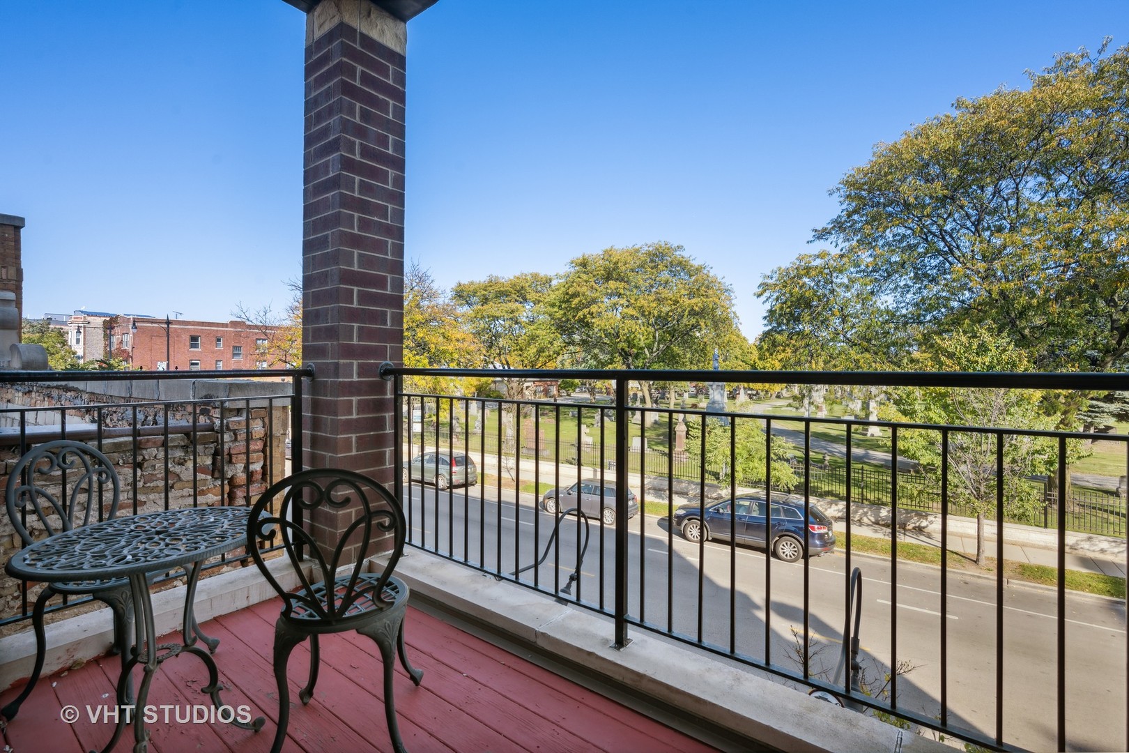 4880 North Clark Street, Unit 2B Chicago, IL 60640 - Photo 14 of 15 a view of balcony with wooden floor and outdoor seating