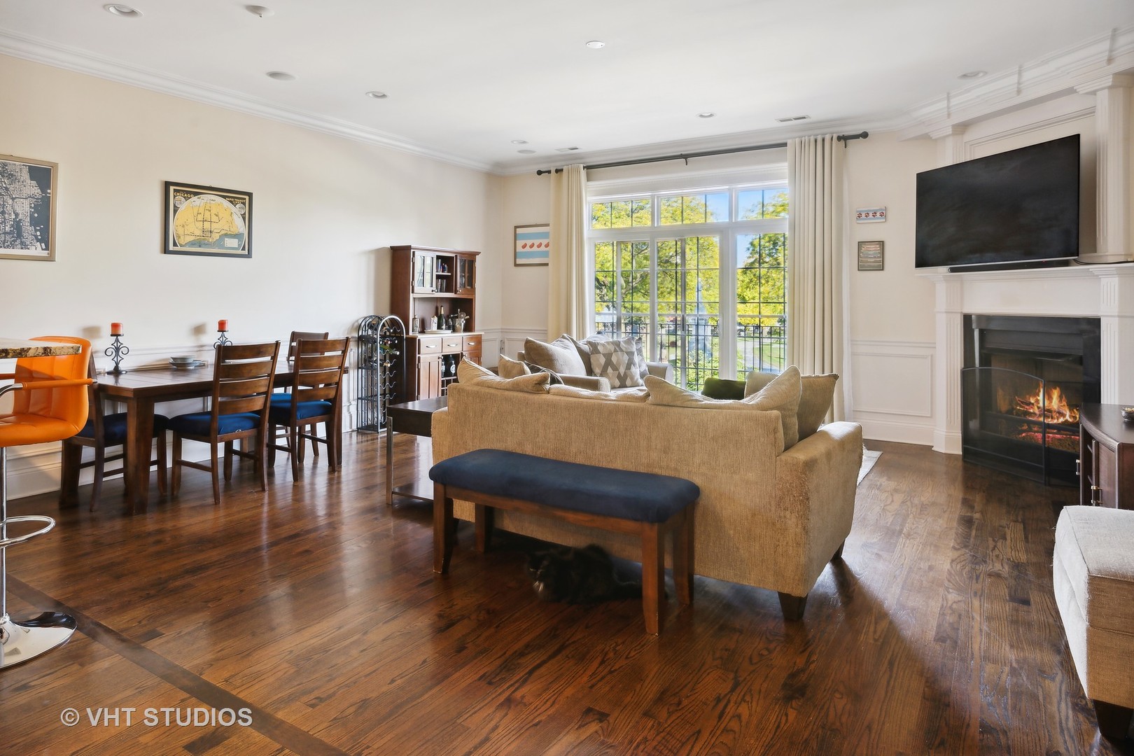 4880 North Clark Street, Unit 2B Chicago, IL 60640 - Photo 2 of 15 a view of a dining room with furniture window and wooden floor