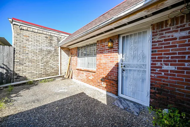 a view of backyard with a door