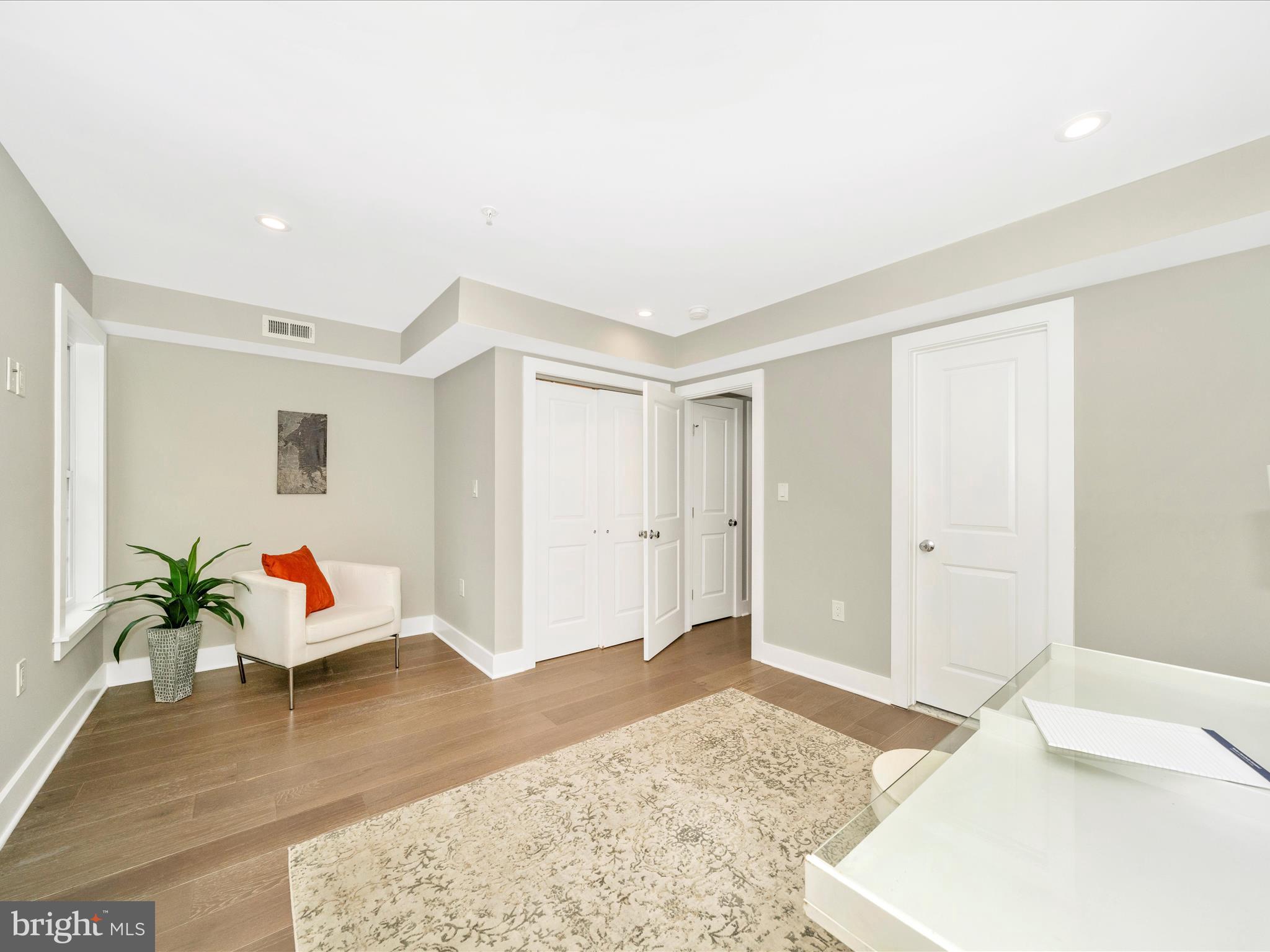1826 Independence Avenue Southeast, Unit 4 Washington, DC 20003 - Photo 14 of 53 a living room with furniture and wooden floor