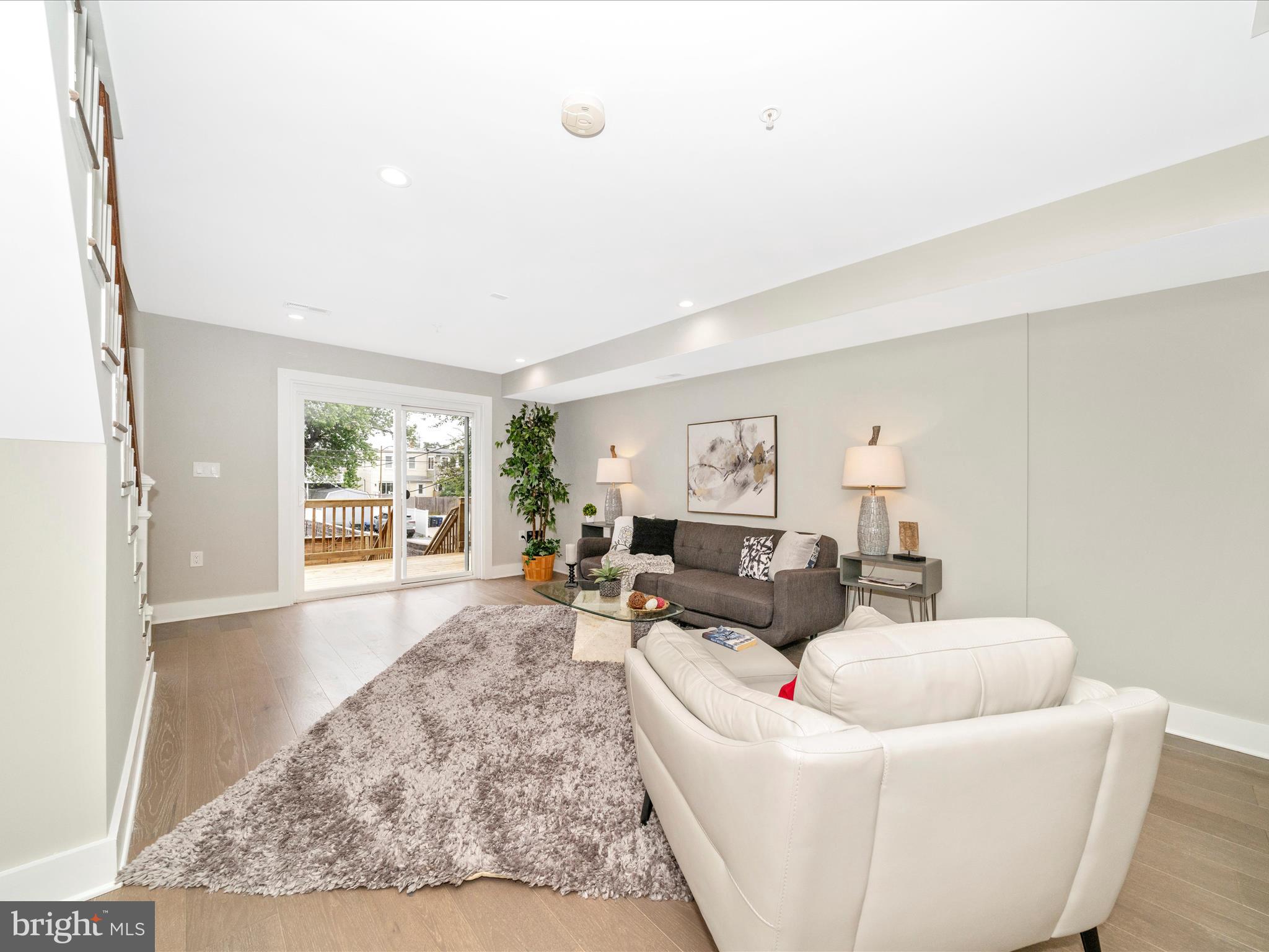 1826 Independence Avenue Southeast, Unit 4 Washington, DC 20003 - Photo 18 of 53 a living room with furniture and a large window