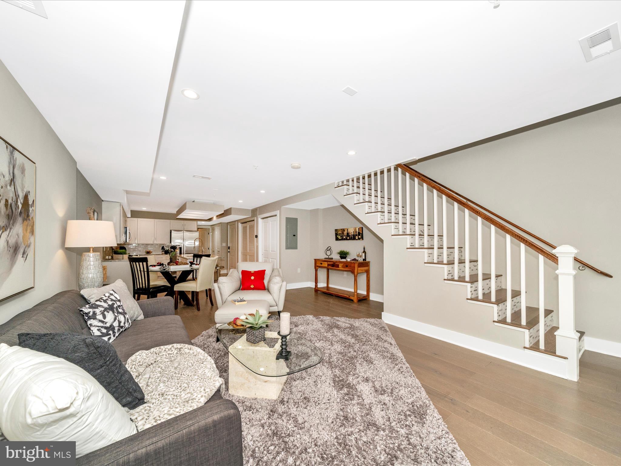 1826 Independence Avenue Southeast, Unit 4 Washington, DC 20003 - Photo 20 of 53 a living room with furniture and a wooden floor