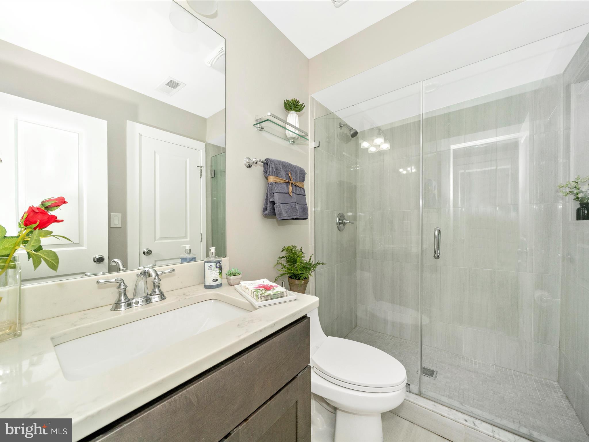 1826 Independence Avenue Southeast, Unit 4 Washington, DC 20003 - Photo 23 of 53 a bathroom with a sink a toilet and shower