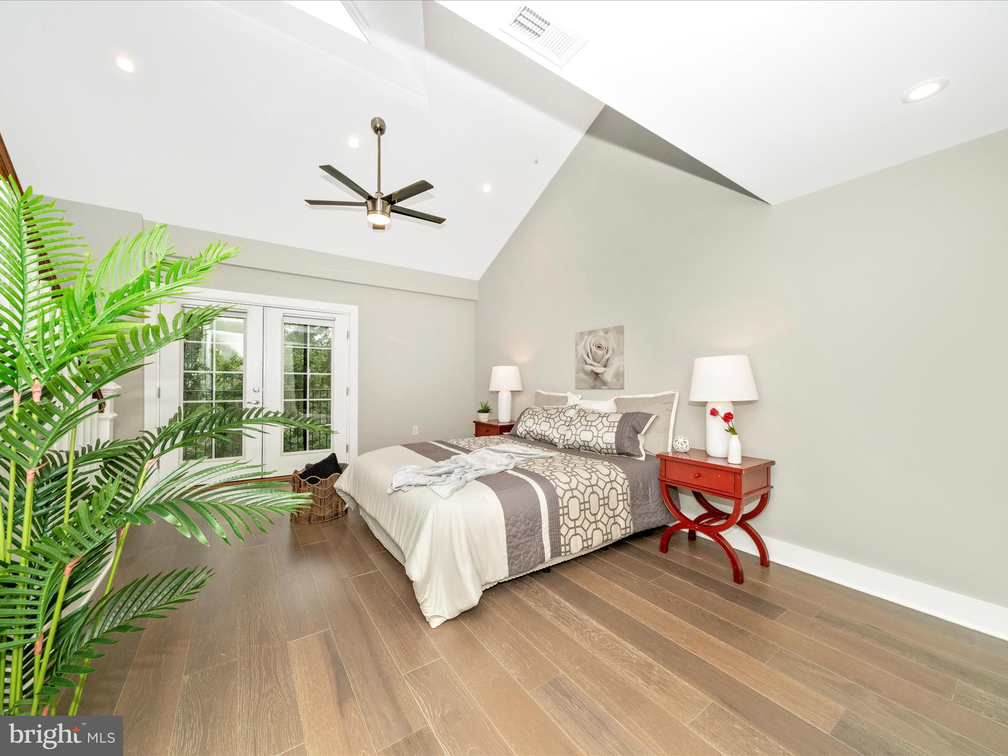 1826 Independence Avenue Southeast, Unit 4 Washington, DC 20003 - Photo 24 of 53 a bedroom with a bed and a chandelier