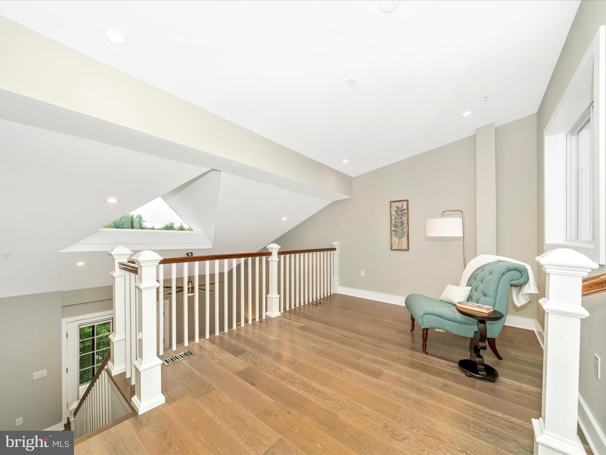 1826 Independence Avenue Southeast, Unit 4 Washington, DC 20003 - Photo 28 of 53 a living room with furniture and a wooden floor