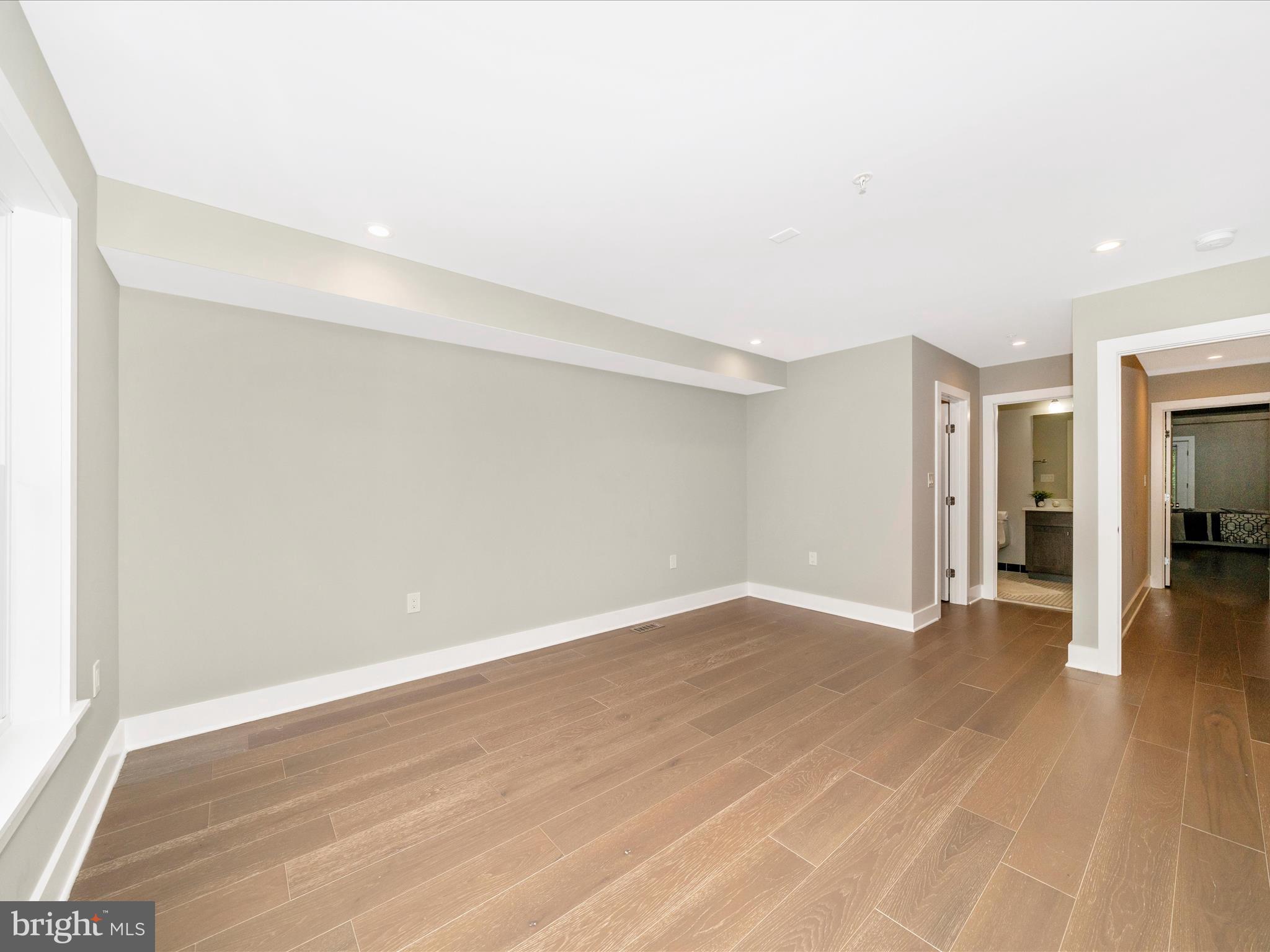 1826 Independence Avenue Southeast, Unit 4 Washington, DC 20003 - Photo 44 of 53 a view of an empty room with wooden floor