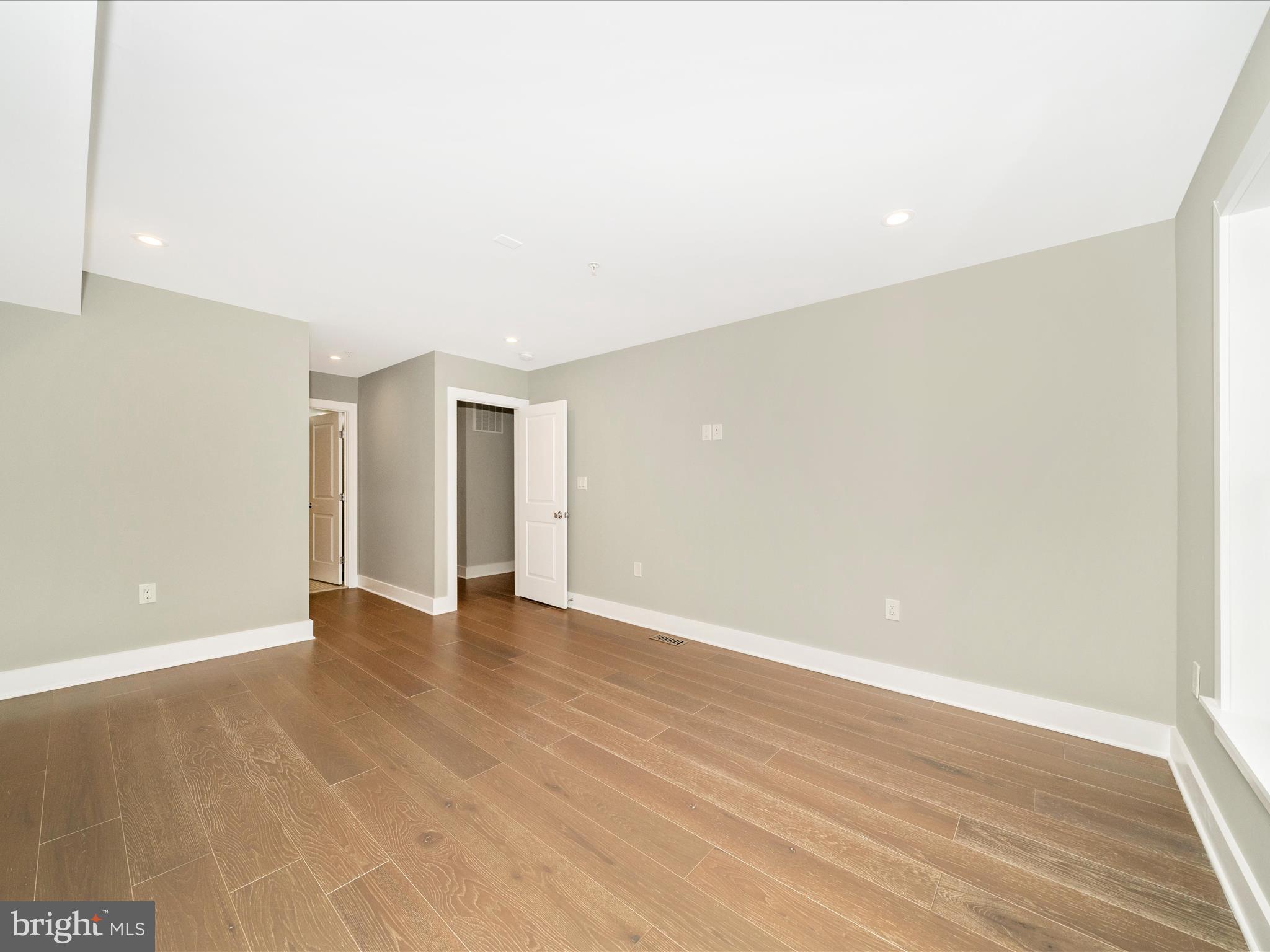 1826 Independence Avenue Southeast, Unit 4 Washington, DC 20003 - Photo 45 of 53 a view of an empty room with wooden floor