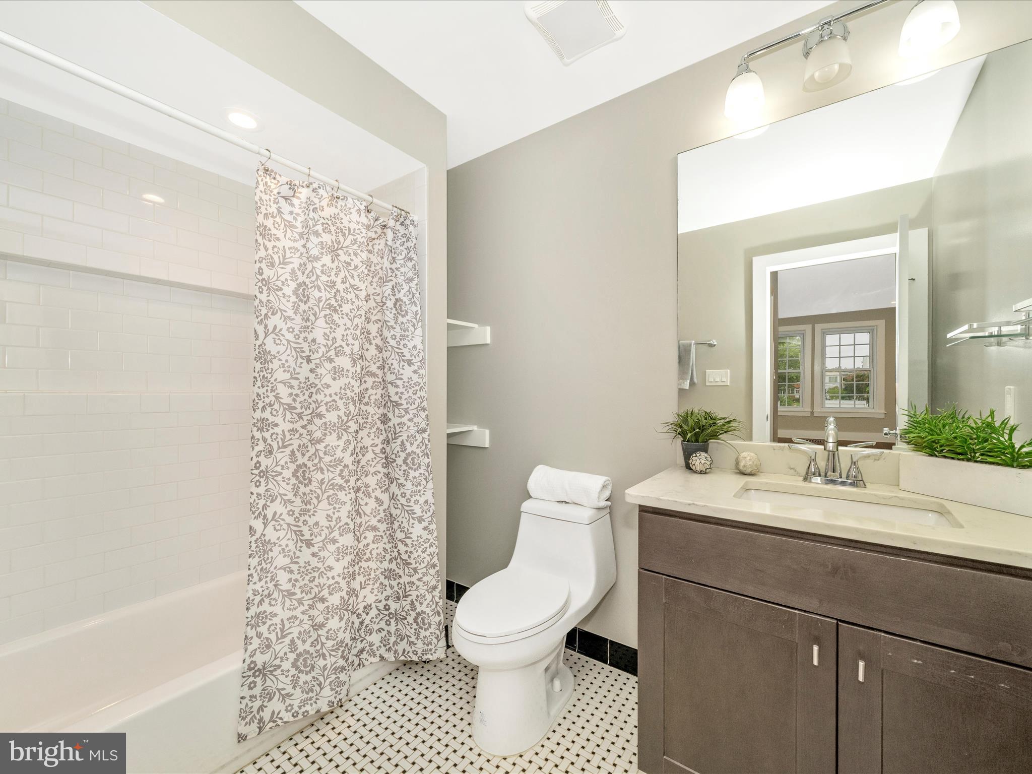 1826 Independence Avenue Southeast, Unit 4 Washington, DC 20003 - Photo 47 of 53 a bathroom with a sink a toilet and shower