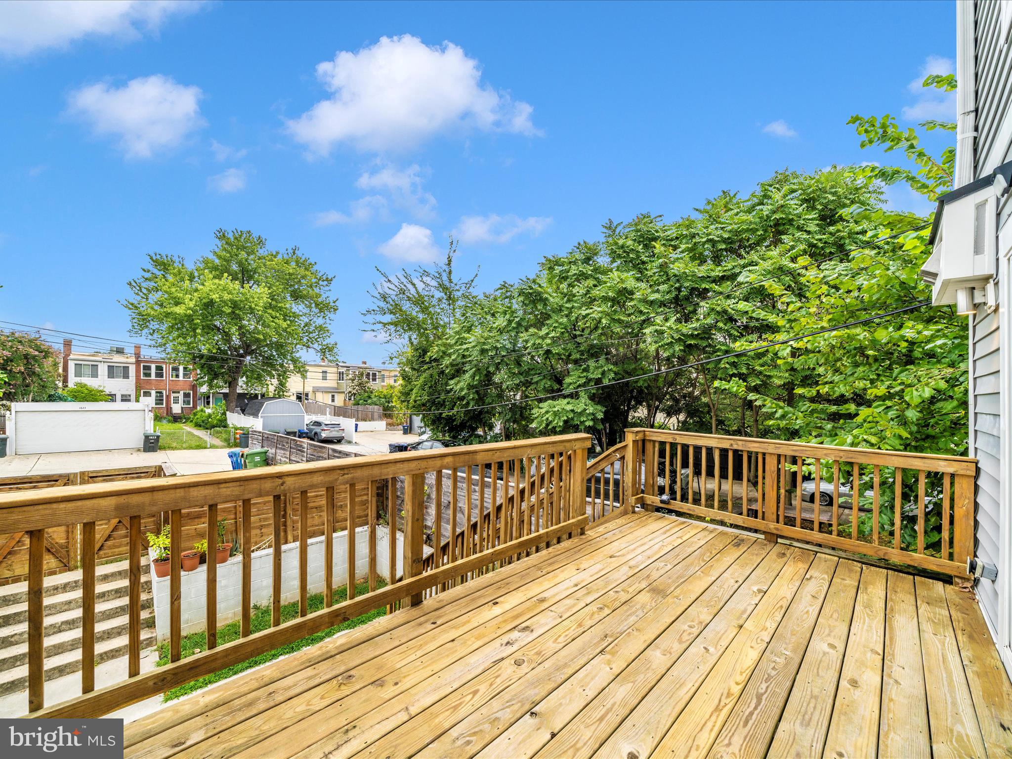 1826 Independence Avenue Southeast, Unit 4 Washington, DC 20003 - Photo 51 of 53 a view of balcony with wooden floor and fence