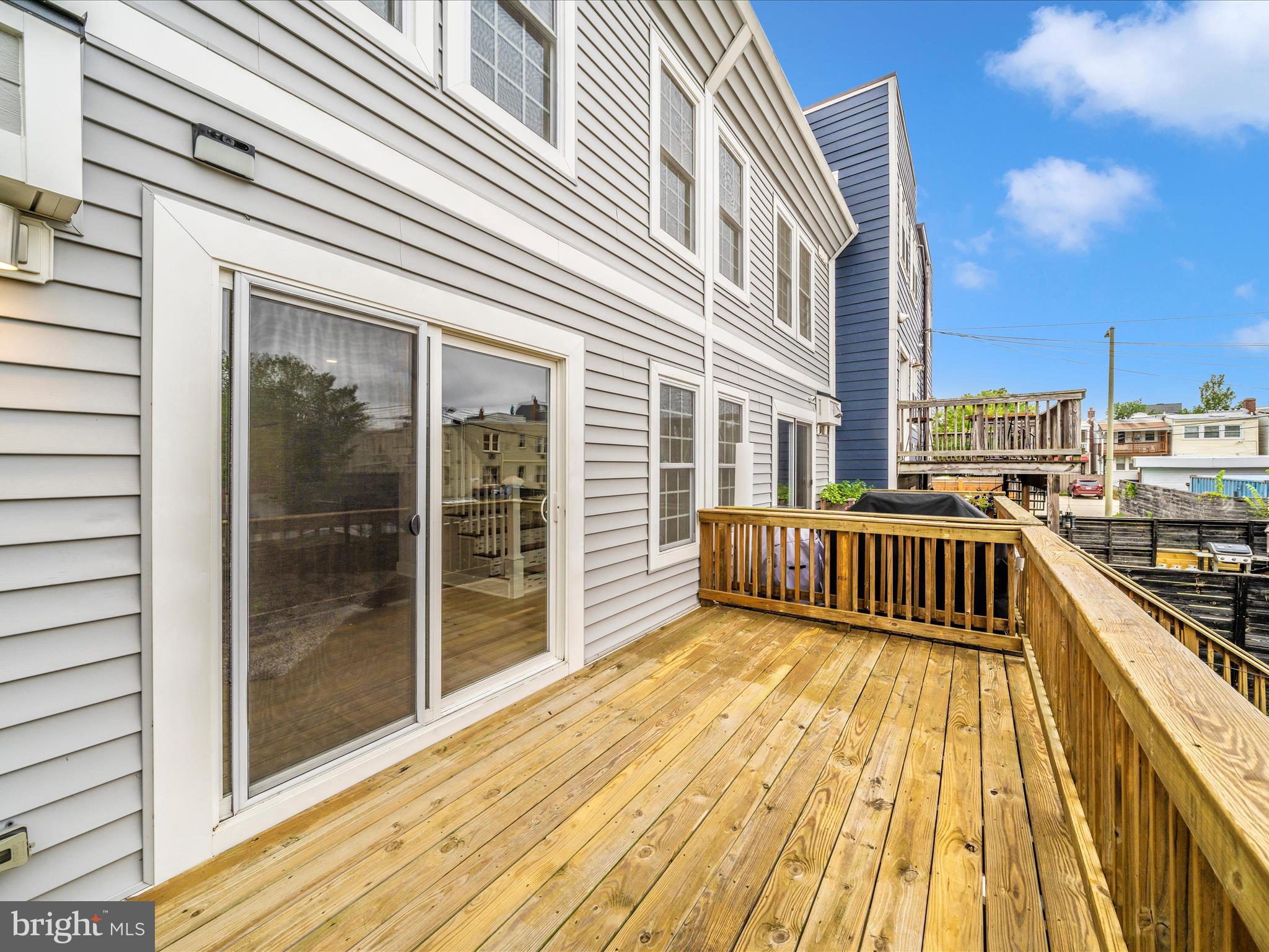 1826 Independence Avenue Southeast, Unit 4 Washington, DC 20003 - Photo 52 of 53 a view of a balcony with wooden floor and city view