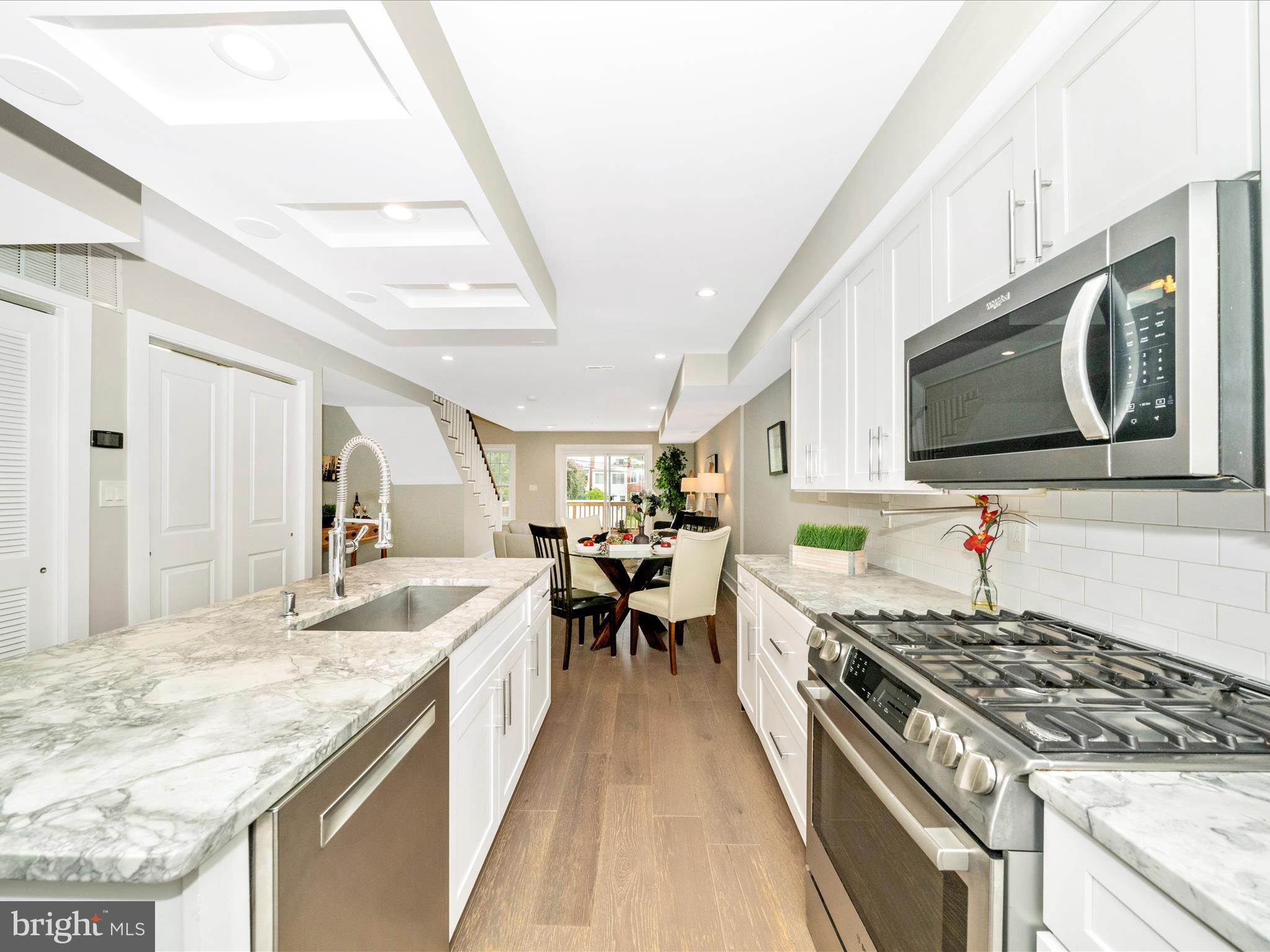 1826 Independence Avenue Southeast, Unit 4 Washington, DC 20003 - Photo 7 of 53 a kitchen with a stove and a sink