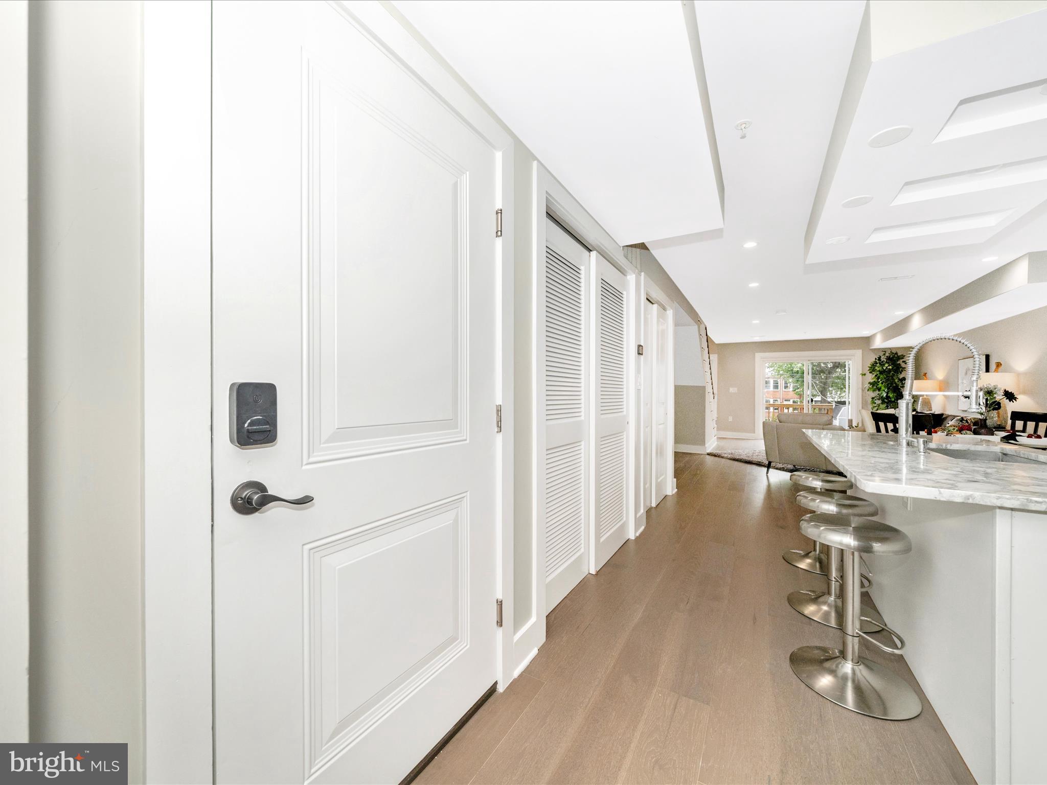 1826 Independence Avenue Southeast, Unit 4 Washington, DC 20003 - Photo 10 of 53 a view of a hallway with furniture and floor to ceiling window