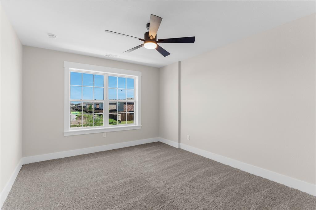 1650 Palladio Loop, Unit 2 Princeton, TX 75407 - Photo 6 of 14 an empty room with fan and windows