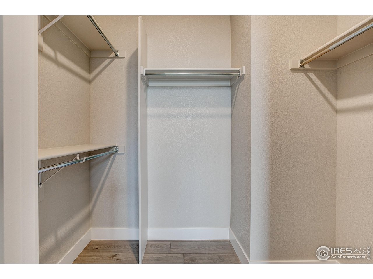 235 High Point Drive, Unit 204 Longmont, CO 80504 - Photo 12 of 22 Primary walk-in closet.