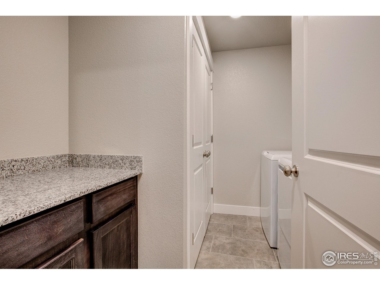 235 High Point Drive, Unit 204 Longmont, CO 80504 - Photo 9 of 22 Laundry room with built in cabinets!