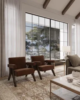 a dining room with furniture and a large window