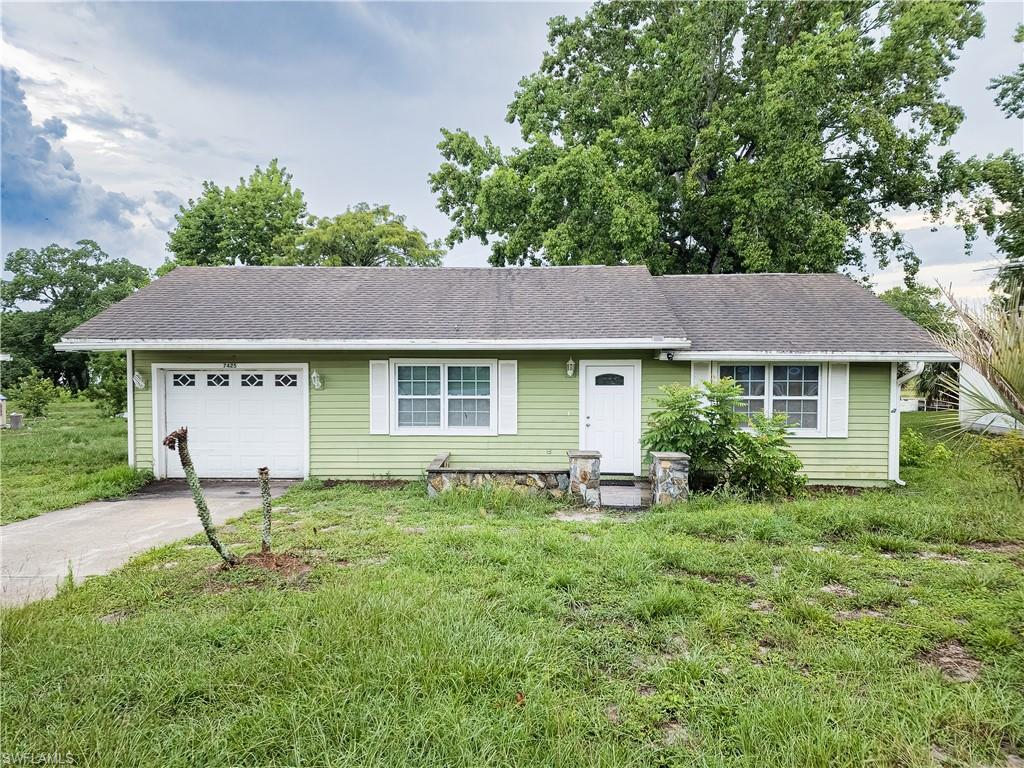 7425 Galloway Road Weeki Wachee, FL 34613 - Photo 1 of 23 a view of a house with a yard and sitting area