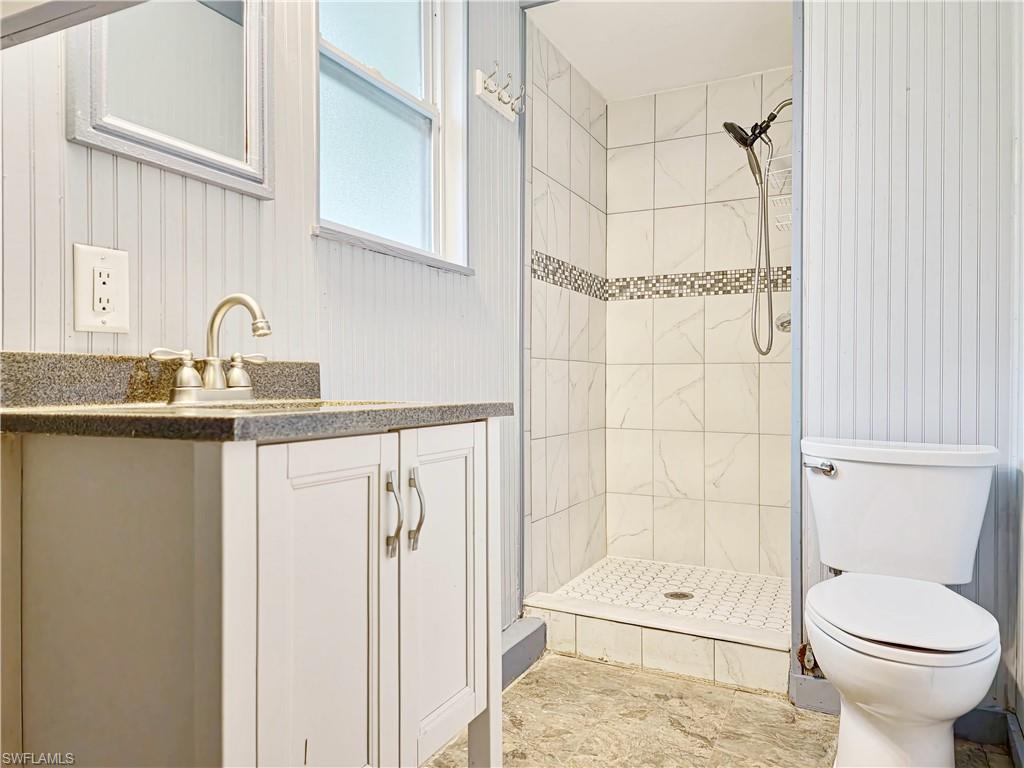 7425 Galloway Road Weeki Wachee, FL 34613 - Photo 14 of 23 a bathroom with a sink toilet and shower