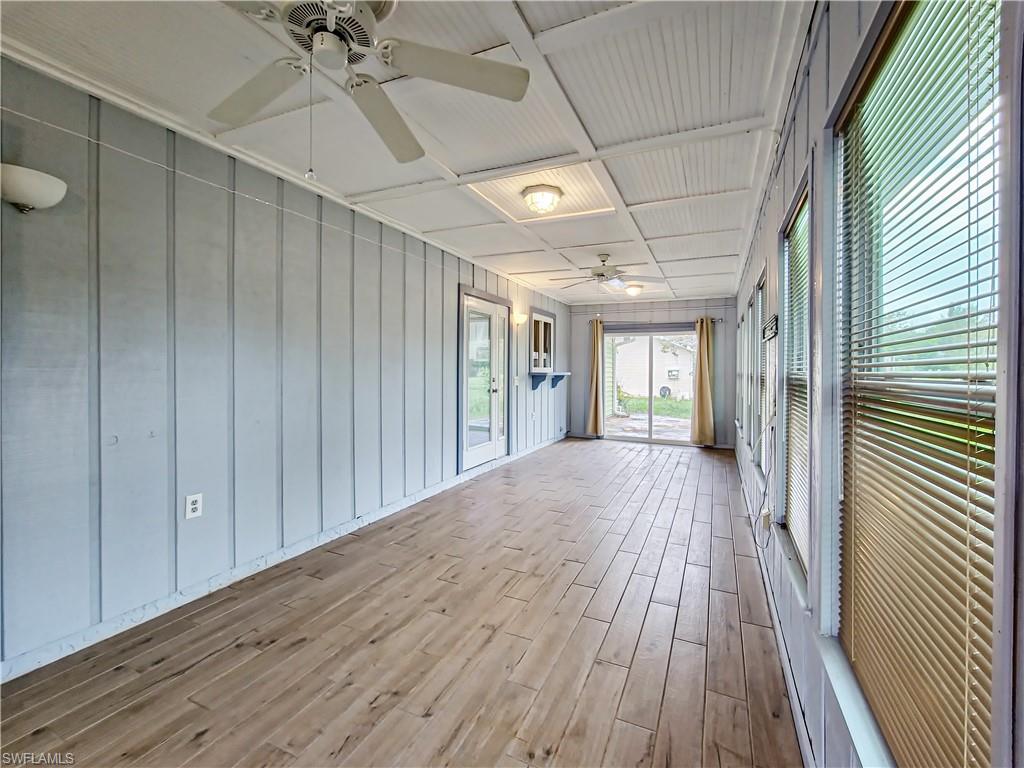 7425 Galloway Road Weeki Wachee, FL 34613 - Photo 17 of 23 a view of a hallway with wooden floor