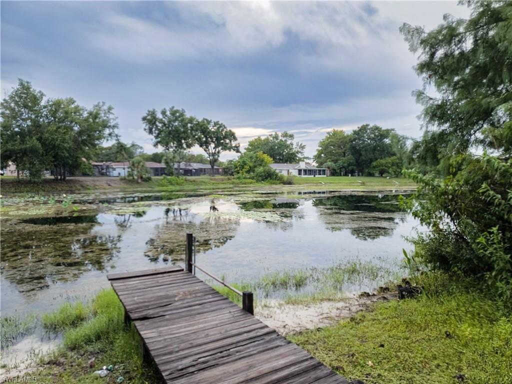 7425 Galloway Road Weeki Wachee, FL 34613 - Photo 23 of 23 a view of a lake with houses in the back
